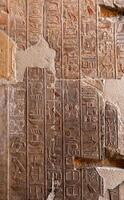 EGYPT, LUXOR - MARCH 01, 2019 archaeological site, drawings and geoglyphs on the walls of an ancient temple, the temple of Hatshepsut near Luxor in Egypt photo