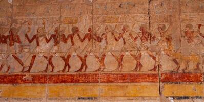EGYPT, LUXOR - MARCH 01, 2019 archaeological site, drawings and geoglyphs on the walls of an ancient temple, the temple of Hatshepsut near Luxor in Egypt photo