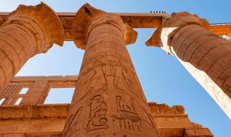 EGYPT, LUXOR - MARCH 01, 2019 ancient temple columns with hieroglyphs, drawings and inscriptions at Karnak in Luxor, Egypt photo