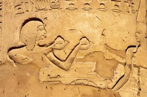 EGYPT, LUXOR - MARCH 01, 2019 drawings and inscriptions on the walls and columns in the temple of Karnak in Luxor photo