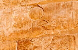 EGYPT, LUXOR - MARCH 01, 2019 ancient Egyptian hieroglyphs, drawings and inscriptions on the walls and columns in the temple of Karnak in Luxor photo