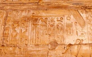EGYPT, LUXOR - MARCH 01, 2019 ancient Egyptian hieroglyphs, drawings and inscriptions on the walls and columns in the temple of Karnak in Luxor photo