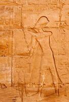 EGYPT, LUXOR - MARCH 01, 2019 ancient Egyptian hieroglyphs, drawings and inscriptions on the walls and columns in the temple of Karnak in Luxor photo