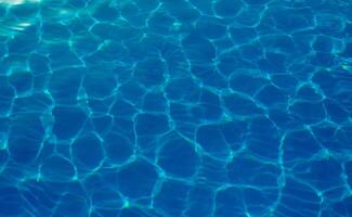 The reflection of the suns rays in the water in the pool with sea water, The glare of the sun, Egypt photo