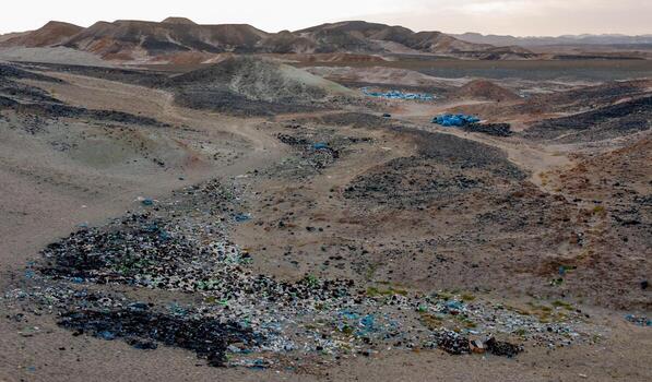Plastic bottles and various garbage from hotels in the wild, Garbage dump in the desert in Egypt photo