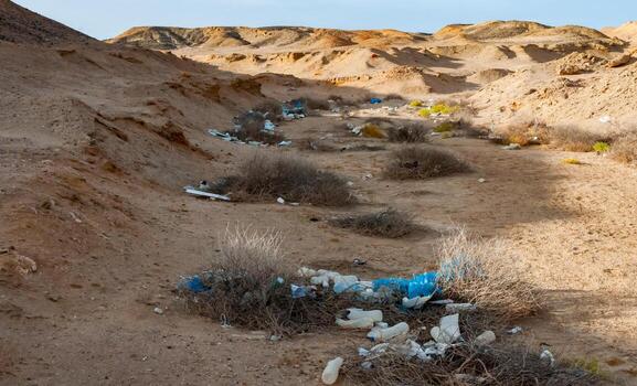 Plastic bottles and various garbage from hotels in the wild, Garbage dump in the desert in Egypt photo