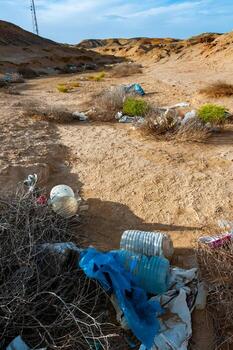 Plastic bottles and various garbage from hotels in the wild, Garbage dump in the desert in Egypt photo