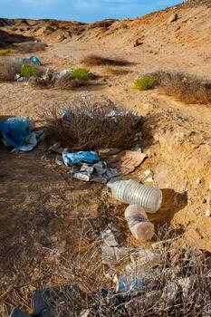 Plastic bottles and various garbage from hotels in the wild, Garbage dump in the desert in Egypt photo