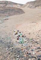 Plastic bottles and various garbage from hotels in the wild, Garbage dump in the desert in Egypt photo