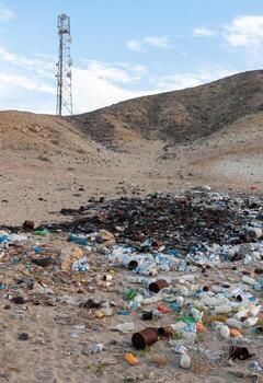 Plastic bottles and various garbage from hotels in the wild, Garbage dump in the desert in Egypt photo