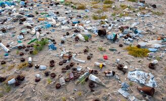 Plastic bottles and various garbage from hotels in the wild, Garbage dump in the desert in Egypt photo