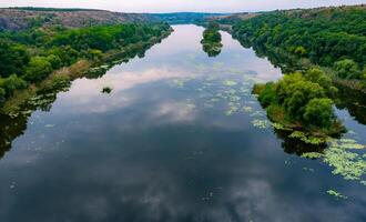 Old floodplain forest along the banks of the Southern Bug River in a granite canyon photo