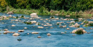A fisherman in a rubber boat catches fish behind rock rifts in the middle photo