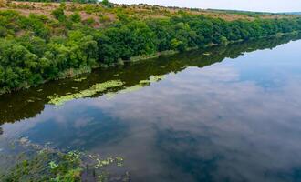 Old floodplain forest along the banks of the Southern Bug River in a granite canyon photo