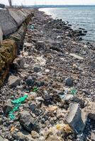 Plastic garbage and microplastics on the shore of Khadzhibey Estuary photo