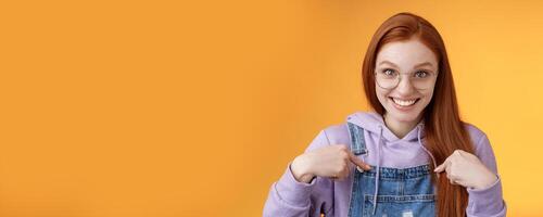 Surprised happy pleased happy smiling young redhead girl getting awesome proposal grinning questioned pointing herself laughing full disbelief receive promotion unbelievable chance photo