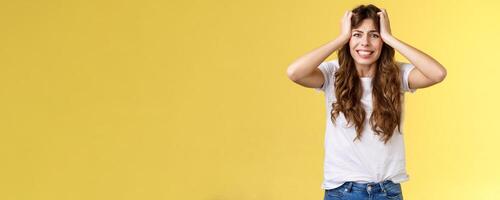 Girl panicking huge trouble suffer panic-attack grimacing painful feelings inside hold hands head troubled frustrated frowning anxiously staring camera troublesome problematic situation photo