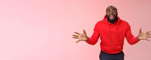 Please no not my games. Portrait shocked devastated panicking young bearded african american guy begging girlfriend not delete favorite app widen eyes yelling supplicating gesturing hands upset photo