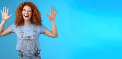 Fine you won. Cheerful carefree playful attractive redhead curly girlfriend having fun laughing out loud joyful raise hands up surrender fool around enjoy cool awesome time spending friend photo