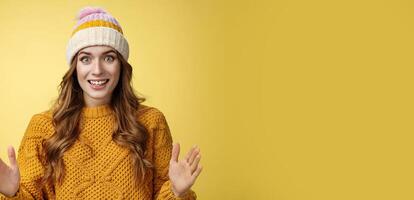 Amazed excited attractive young 20s girl describing large awesome product show big box shape smiling astonished standing thrilled impressed incredible merch, standing yellow background photo