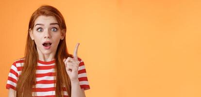 Got idea. Excited redhead woman sharing interesting plan, raise index finger eureka gesture, open mouth say thought, remember important thing, stare camera stunned, finally understand photo