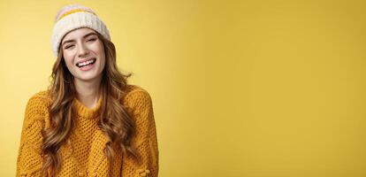 Close-up flirty coquettish good-looking happy smiling woman laughing having fun enjoying interesting funny conversation grinning joyfully wearing warm cozy corduroy hat, knitted sweater photo