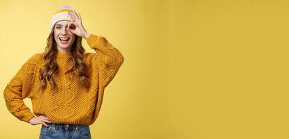 Smiling optimistic happy charming girl show okay ok gesture assuring everthing alright keep up supporting you, like awesome idea excited try out, standing satisfied yellow background photo