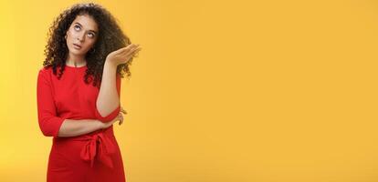 Girl being annoyed unwilling to listen boyfriend yell rolling eyes up from annoyance and irritation sighing bothered slapping forehead with palm fed up and disappointed over yellow background photo