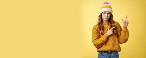 Picky sulking cute girlfriend wanna new smartphone look camera whining upset crying pointing upper right corner sad telling you fullfill wish, standing displeased whining yellow background photo