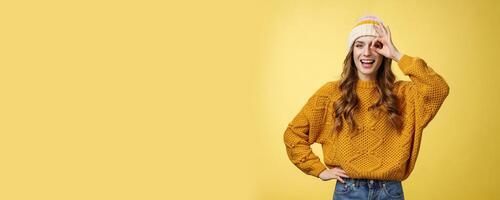 Smiling optimistic happy charming girl show okay ok gesture assuring everthing alright keep up supporting you, like awesome idea excited try out, standing satisfied yellow background photo