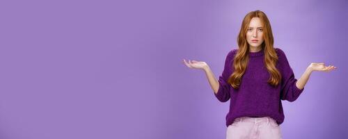 What your problem. Frustrated, confused and annoyed redhead girlfriend arguing cannot get clue why bother shrugging with raised hadns aside and puzzled expression, irritated with stupid quarrel photo