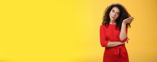 Girl being annoyed unwilling to listen boyfriend yell rolling eyes up from annoyance and irritation sighing bothered slapping forehead with palm fed up and disappointed over yellow background photo