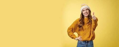 Lucky good-looking friendly supportive girlfriend congratulating you nice work good job show thumb-up gesture satisfied liking awesome product recommend promotion, smiling yellow background photo