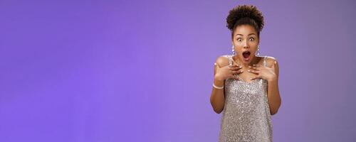 Asonished gasping wondered shocked attractive african-american woman drop jaw speechless pointing herself impressed cannot believe got lucky win first place model contest, blue background photo