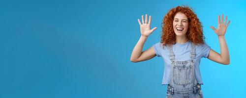 Fine you won. Cheerful carefree playful attractive redhead curly girlfriend having fun laughing out loud joyful raise hands up surrender fool around enjoy cool awesome time spending friend photo