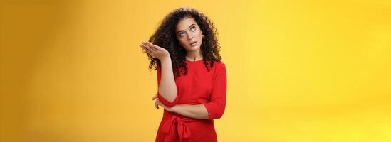 Girl being annoyed unwilling to listen boyfriend yell rolling eyes up from annoyance and irritation sighing bothered slapping forehead with palm fed up and disappointed over yellow background photo