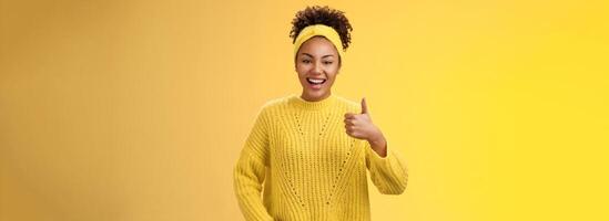 Energetic outgoing good-looking female office assistant ready help out show nice thumbs-up gesture check out awesome result great work done approval sign smiling accepting recommend service photo