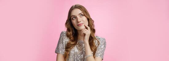 Dreamy cute glamour silly woman deciding what order look up thoughtful touching face thinking making decision choice imaging prince on white horse, smiling carefree pink background photo