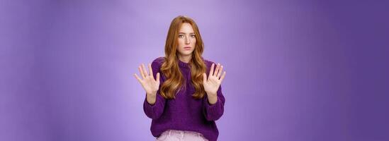 I pass, not even look at me. Portrait of displeased sorrow and intense redhead woman refusing participate in suspicious plan waving hands near chest in rejection looking serious at camera photo