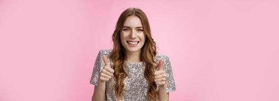 Satisfied supportive attractive feminine girlfriend show thumbs-up cheering for you like approve awesome idea smiling broadly delighted, give positive affirmative answer, pink background photo