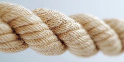 Close-up of a Twisted Beige Rope with Detailed Texture photo