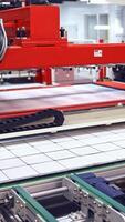 Modern automated production concept. Robotic factory for producing solar panels. Vertical video