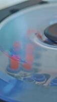 Modern centrifuge machine is working in the medical laboratory. Test tubes with blood inside the centrifuge. Close-up. Top view. Vertical video
