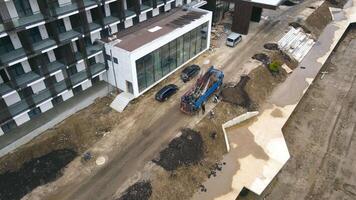 landscaping. Unloading the car with trees for improvement of the territory. Top view of unloading trees in large pots video
