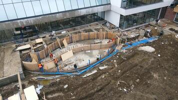 Workers are building a system of pools with thermal water. Pool construction. video