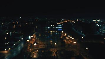 blurred night city background with colored bokeh. View of the city from a height out of focus. video