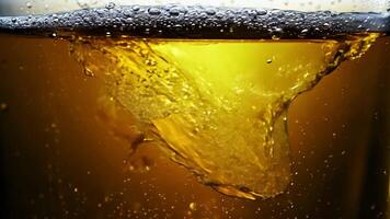 Bubbles and foam in glass with yellow liquid, drink texture video