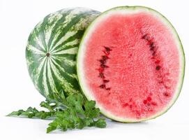 Watermelon with a slice and leaves photo