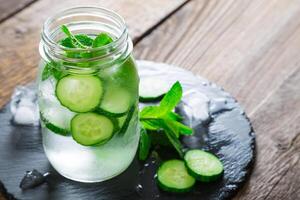 Refreshing water with cucumber and mint photo