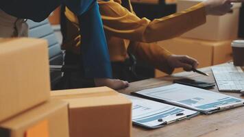 Start Up Business or small SME business owners open an office at home conduct online business and check product stock before sending products according orders customers who order products online. video